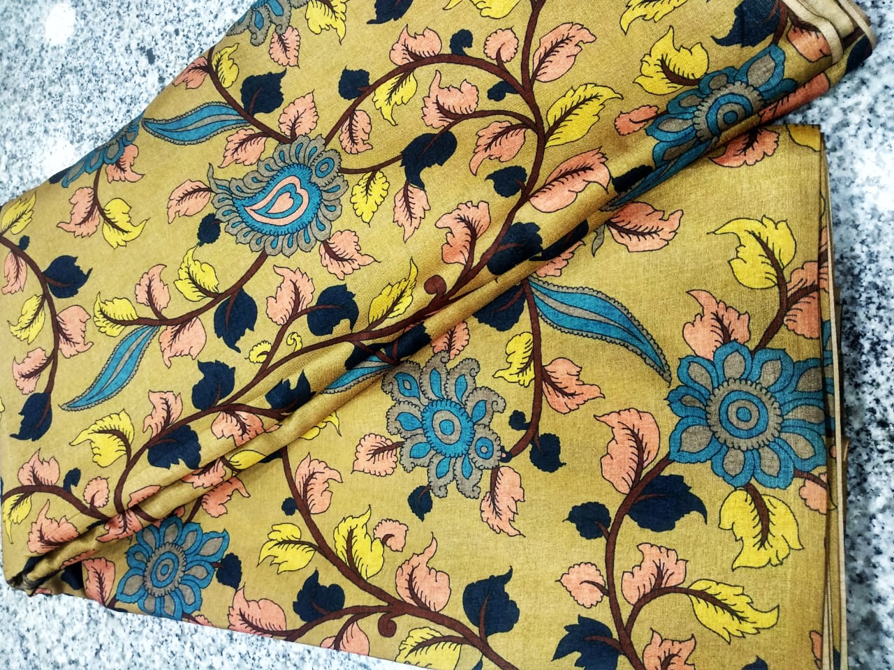 MUSTERED YELLOW COLOR TUSSAR KALAMKARI PRINTED FABRIC .