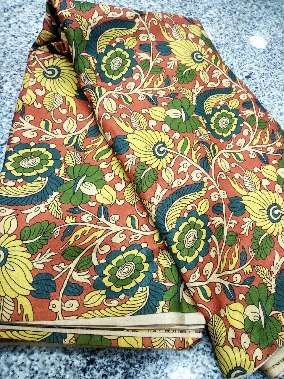 YELLOW COLOR KALAMKARI PRINTED TUSSAR FABRIC.